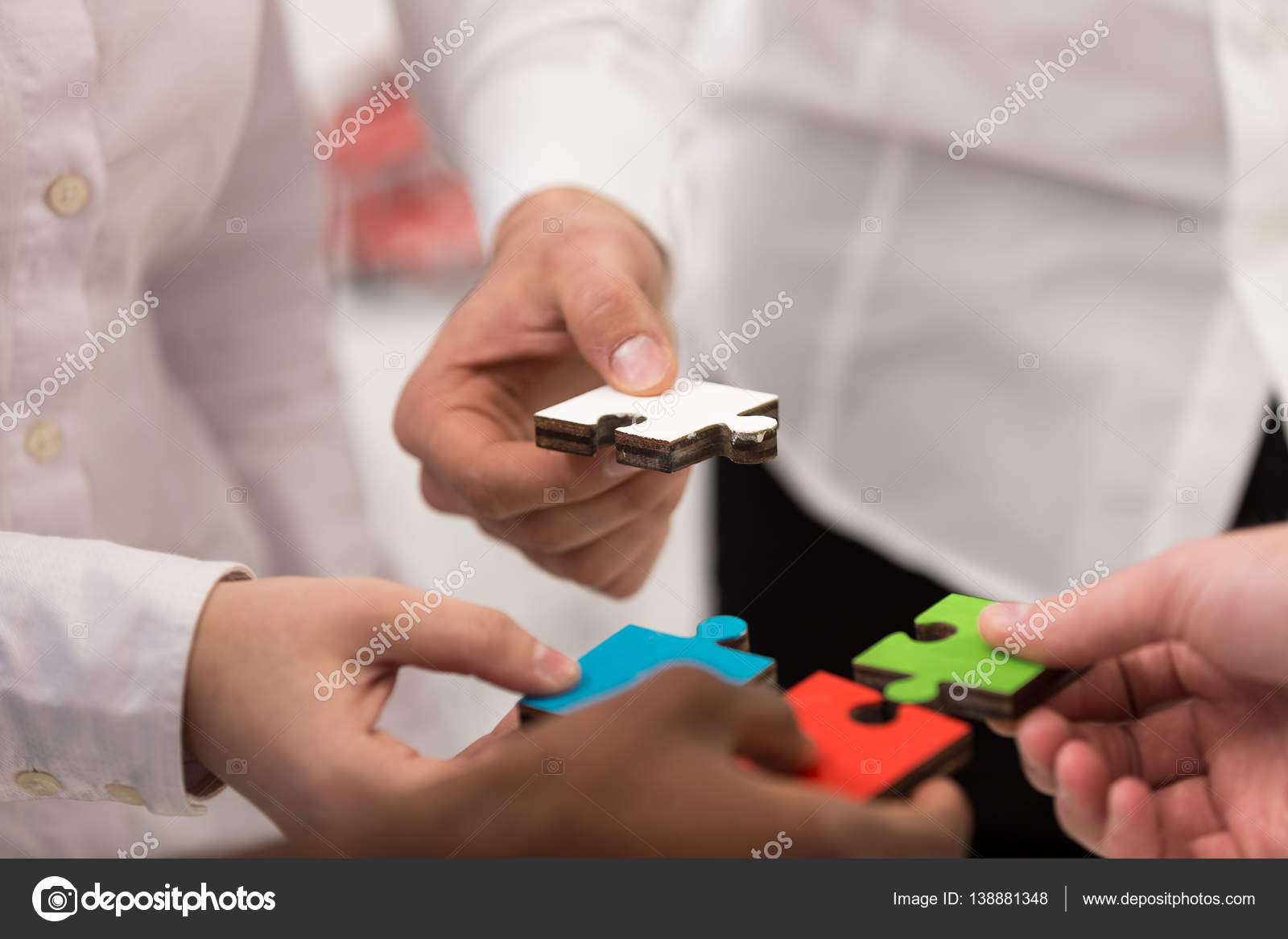 Business people group assembling jigsaw puzzle — Stock Photo © FSStock