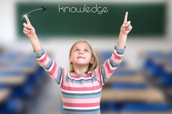 Little girl pointing on knowledge sign
