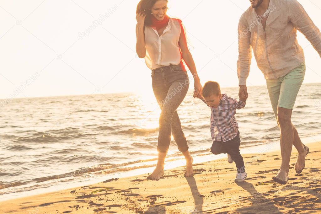 young family have fun on beach 