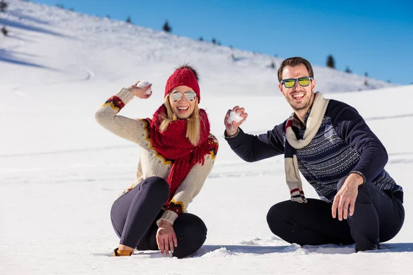 Couple playing Snowball fight. — Stock Photo, Image