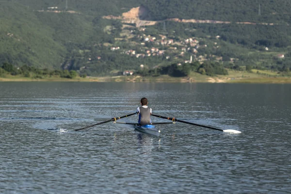 Child rowing on single kayak — Stock Photo, Image