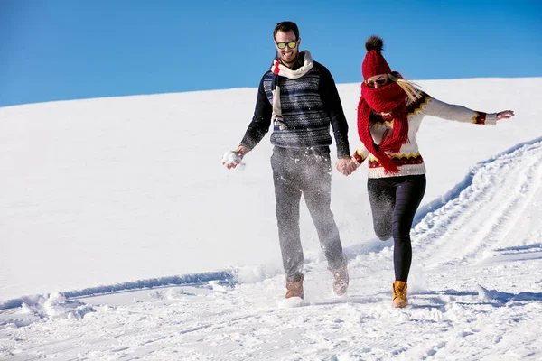 Couple having fun running down slope — Stock Photo, Image
