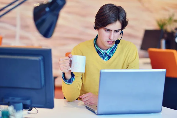 Pleasant man working in the office — Stock Photo, Image