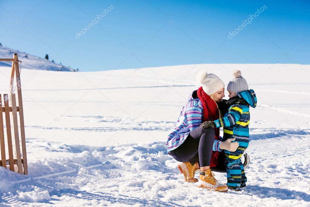 mother and son having fun at winter