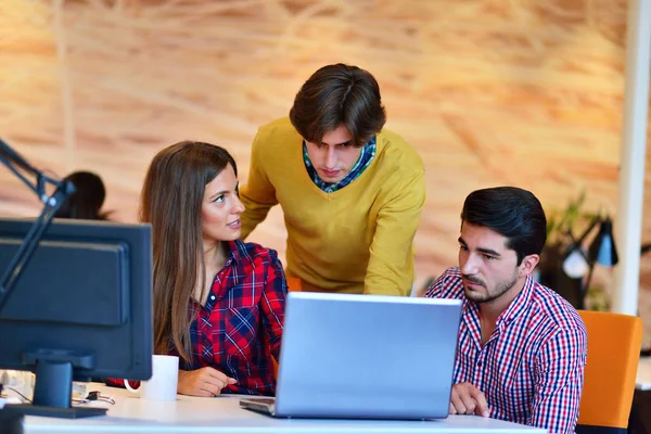 Three young architects working on a project — Stock Photo, Image