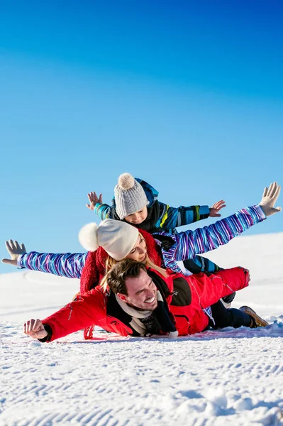 Happy family on ski holiday Stock Photo