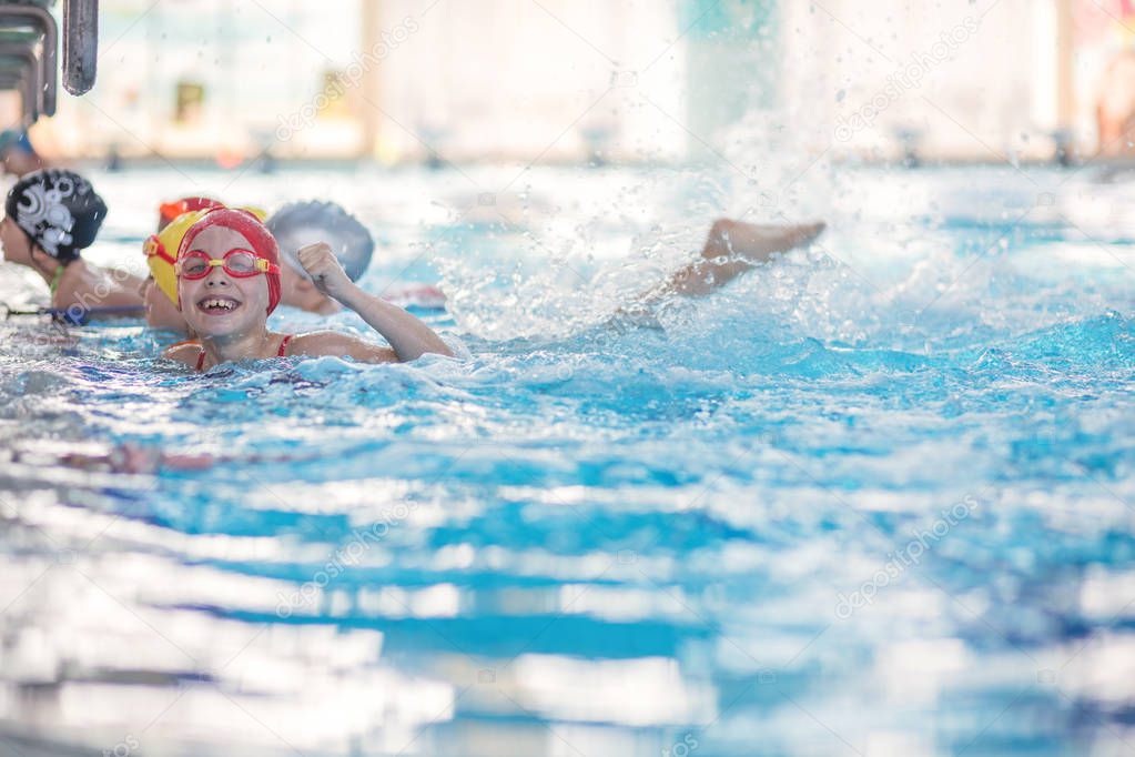 happy children group at swimming pool