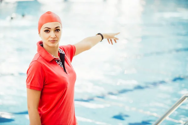 female coach by pool