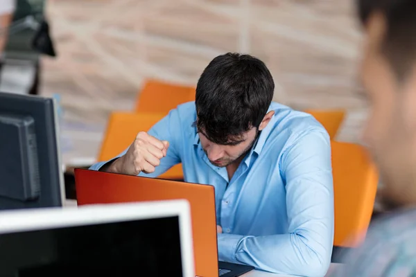 Worried businessman working in office — Stock Photo, Image