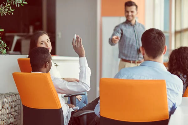 Business, startup, presentation, strategy and people concept - man on presentation with group of people at office — Stock Photo, Image