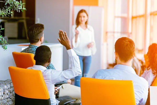 African american Business people Raising there Hand Up at a Conference to answer a question — Stock Photo, Image