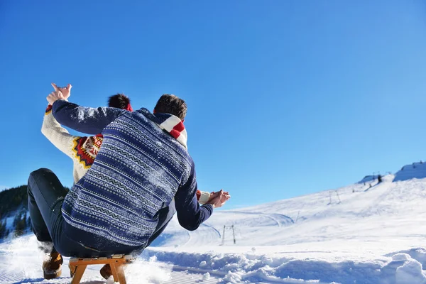 Young Couple Sledding And Enjoying On Sunny Winter Day — Stock Photo, Image