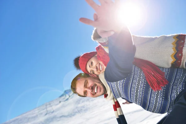 Loving couple playing together in snow outdoor. — Stock Photo, Image