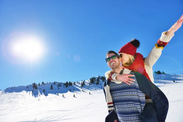 Loving couple playing together in snow outdoor. — Stock Photo, Image