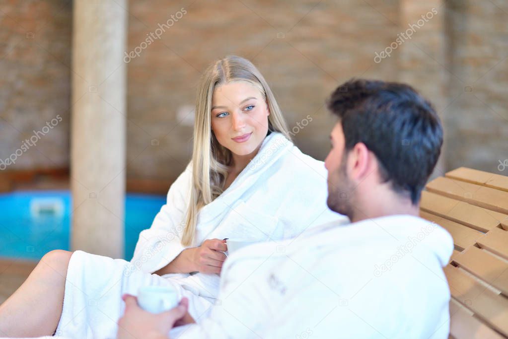 Beautiful couple relaxing together at spa centre after a beauty treatment