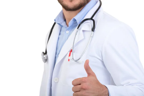 Succès jeune beau et élégant médecin barbu en uniforme blanc debout à fond blanc avec sourire — Photo