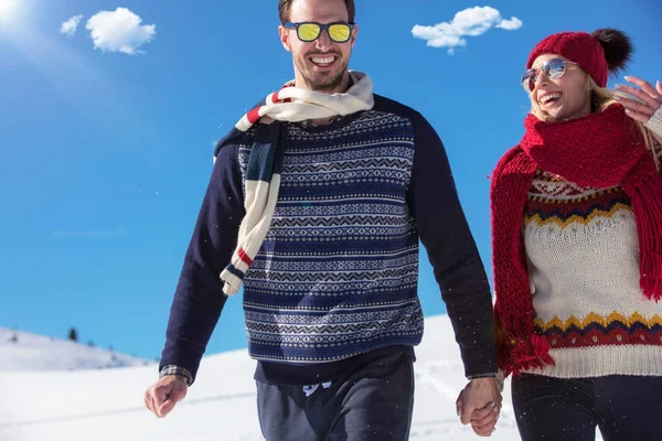 Happy couple playful together during winter holidays vacation outside in snow park — Stock Photo, Image