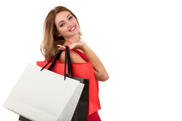 Portré fiatal boldog mosolygó nő, bevásárló táskák, elszigetelt fehér háttér felett — Stock Fotó