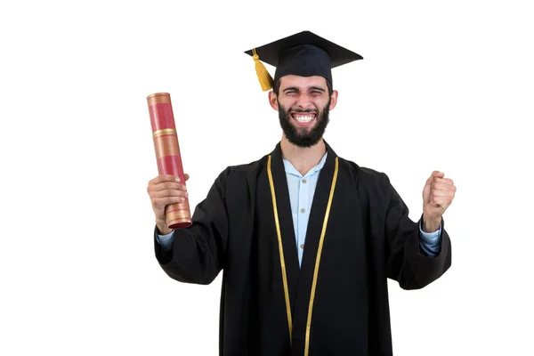 Étudiant diplômé portant une robe et une casquette isolées sur fond blanc — Photo