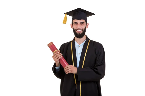 Étudiant diplômé portant une robe et une casquette isolées sur fond blanc — Photo