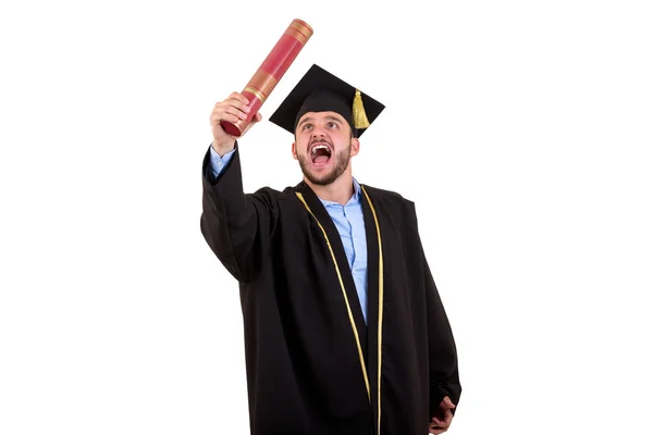 Studente maschio in abito di laurea gesticolando con le mani isolate su sfondo bianco — Foto Stock