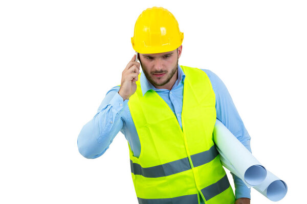 Angry upset young construction engineer yeling at the phone