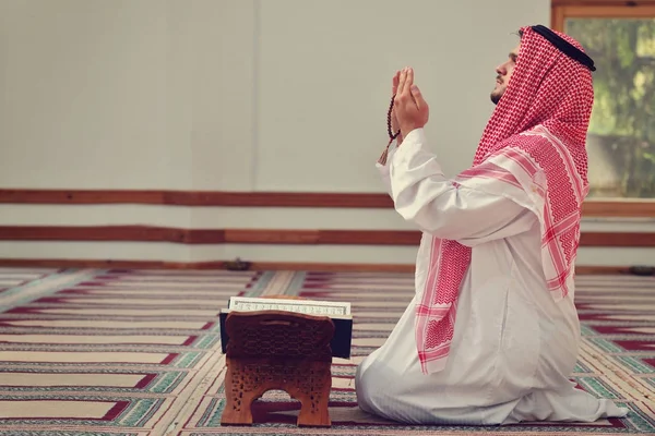 Religious muslim man praying inside the mosque — Stock Photo, Image