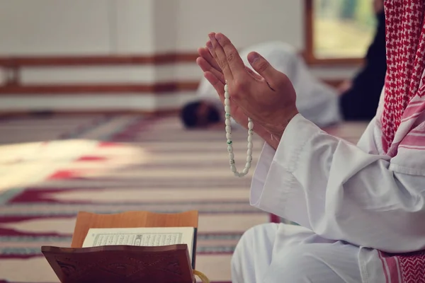 Religious muslim man praying inside the mosque — Stock Photo, Image