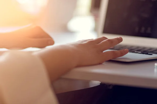 woman using laptop, searching web, browsing information, having workplace at home