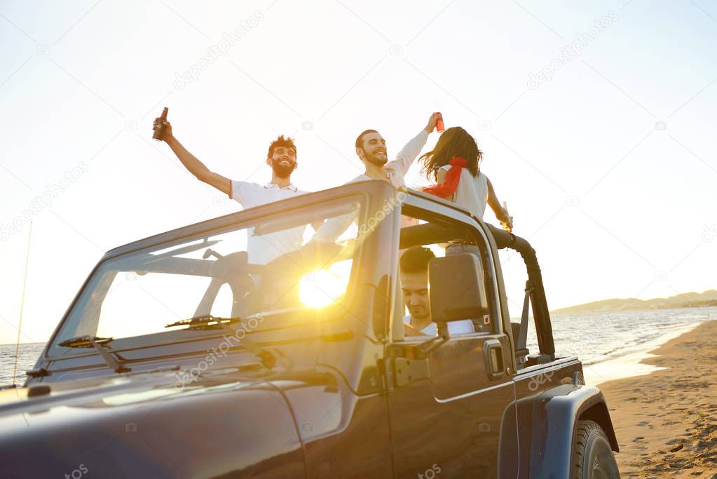 Group of happy friends making party in car - Young people having fun drinking champagne