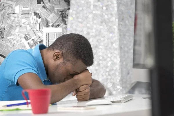 Furious black businessman tired of working on project at office.