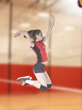 Female volleyball players jumping close-up on vollayball court. clipart