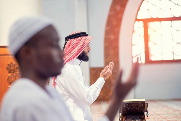 Two religious muslim man praying together inside the mosque — Stock Photo, Image