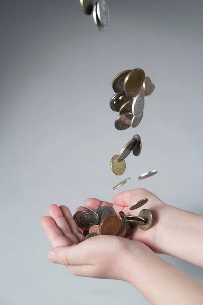 man hands palms up with money coins