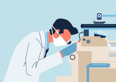 Bir doktor mikroskop altında kan testi yapar..