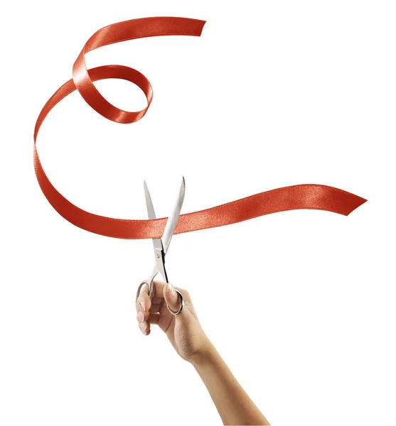 Scissors cutting through red ribbon or tape — Stock Photo, Image