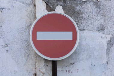 Stop Sign on a stone wall