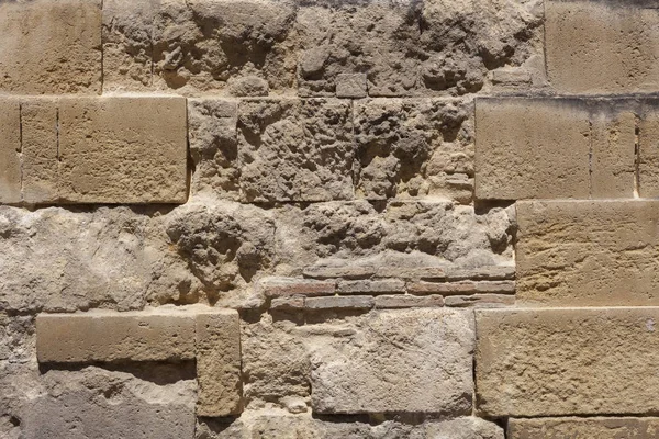 Closeup of a sandstone brick side of building