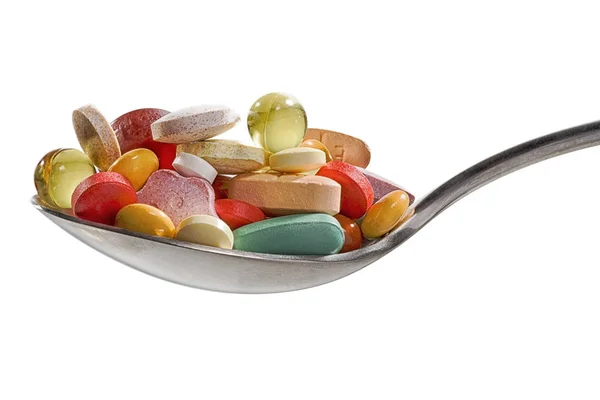 Různé léky vitamíny a výživa doplňků na lžíci — Stock fotografie