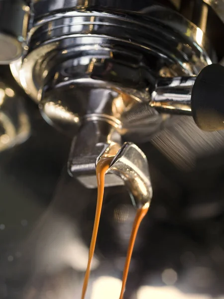 Espresso machine brewing a coffee espresso. Close up