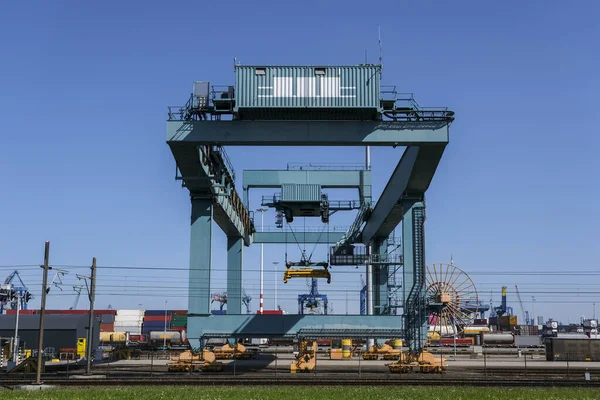 Cargo crane in the Port of Rotterdam. View of container terminal in the harbor Netherlands.
