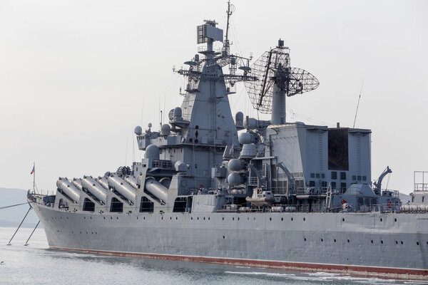 Modern Russian military cruiser battleship on the pierce. Russia, Vladivostok.