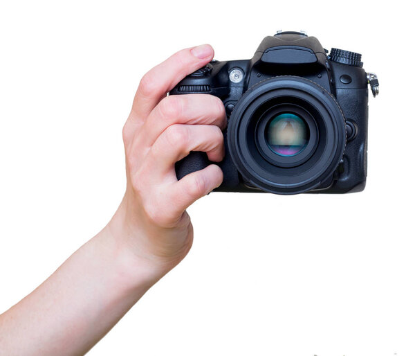 Female hand with modern DSLR camera with lens mounted. Photography equipment. Isolated on white.