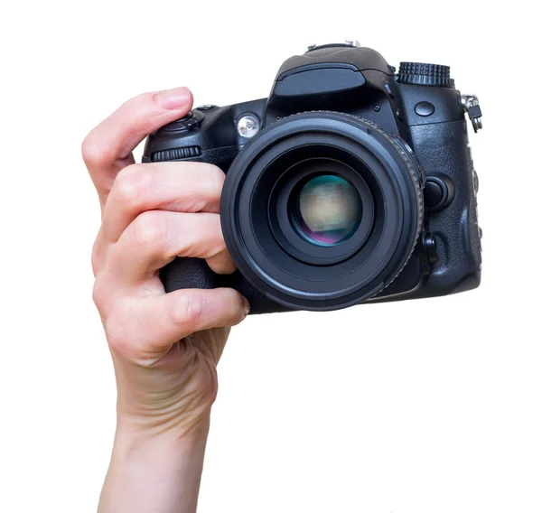 El ile modern Dslr fotoğraf makinesi lens ile monte. Fotoğraf ekipmanı. Beyaz izole.