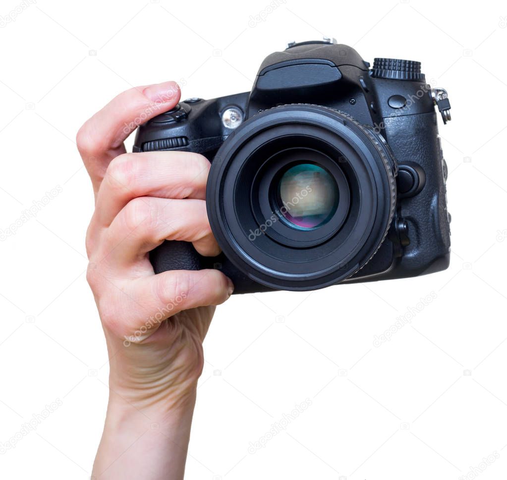 Female hand with modern DSLR camera with lens mounted. Photography equipment. Isolated on white.