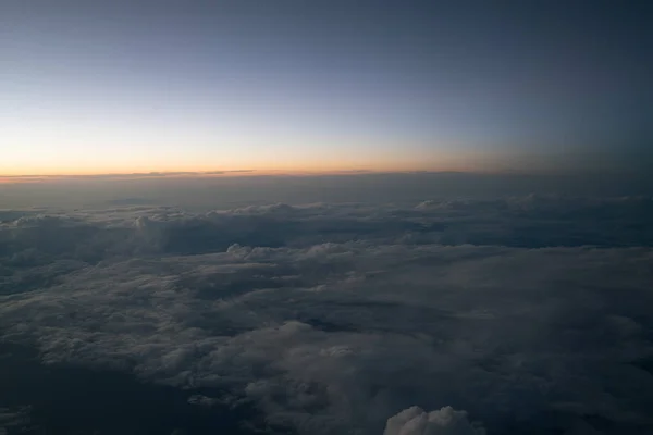 Sunset or sunrise viewed from airplane — Stock Photo, Image