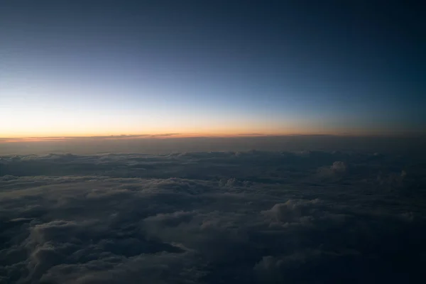 Sunset or sunrise viewed from airplane — Stock Photo, Image