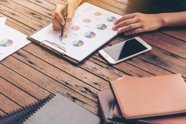 Businesswoman checking a business report