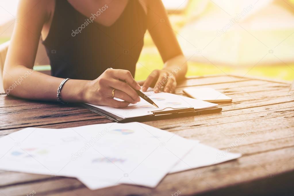 Businesswoman checking a business report