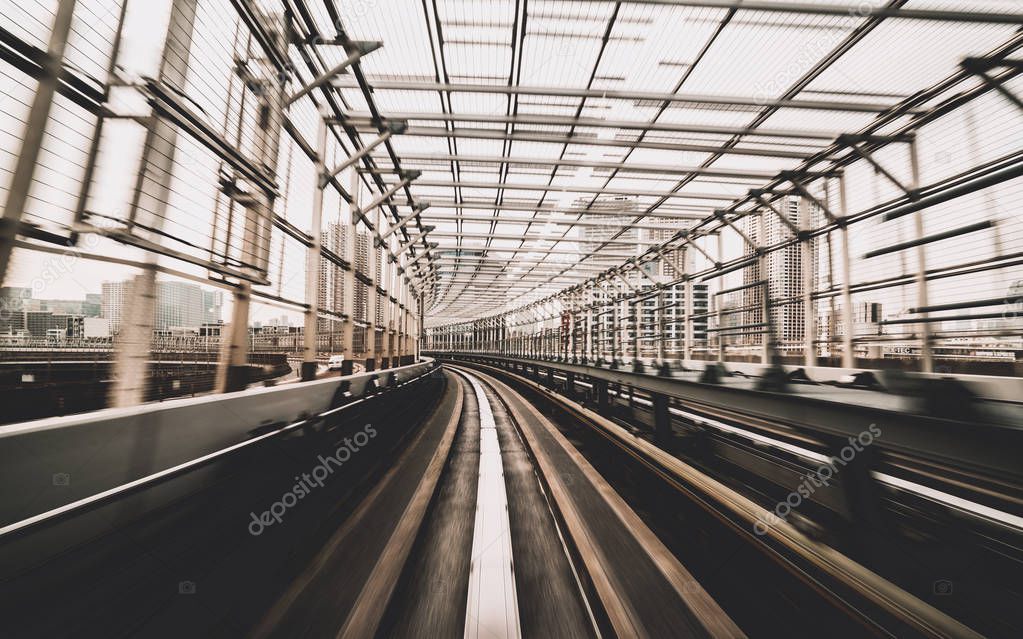 Train moving on city rail with motion blur
